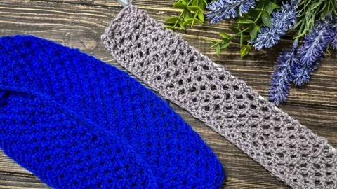 A blue thread pattern on a wooden background. Knitting tutorial and sample of Stock Photos