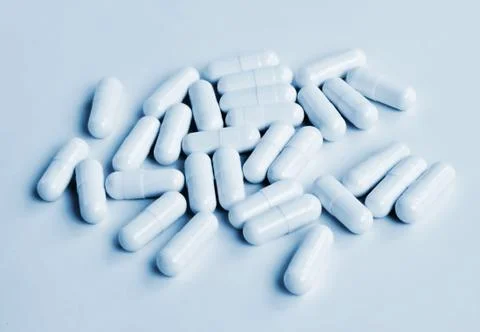 Blue toned capsules Stock Photos