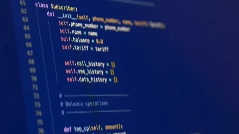 Blue-toned programming interface showing structured code, representing software Stock-Footage 332810812