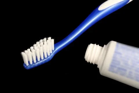Blue toothbrush and toothpaste Stock Photos