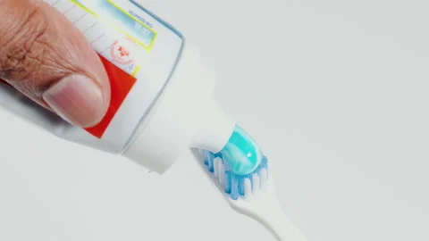 Blue Toothpaste Onto Tooth Brush Vídeo Stock 248710781
