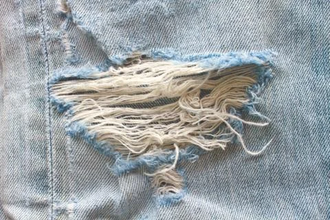 Blue torn denim jeans texture Stock Photos