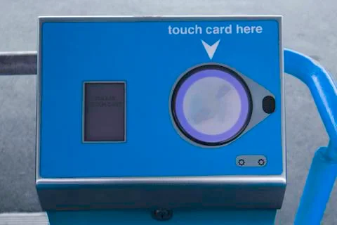 Blue touch on machine at station Foto stock