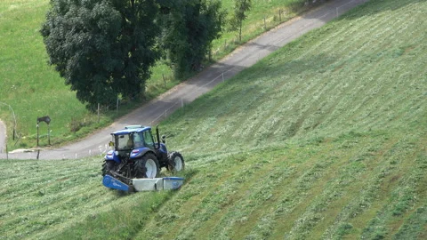 Blue tractor hay cutter Stock Footage 160118758