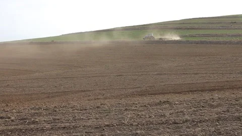 Blue Tractor ploughing on the hill Stock Footage 274281628