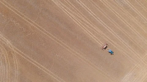 Blue Tractor With Red Seed Drilling Machine In Massive Stubble Field Cine D Stock Footage 107051411