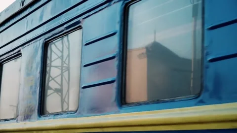 Blue train with people inside moving forward, close up of train window Stock Footage 176432200