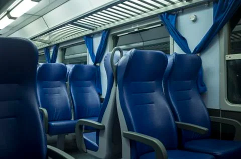 Blue train seats in train Stock Photos