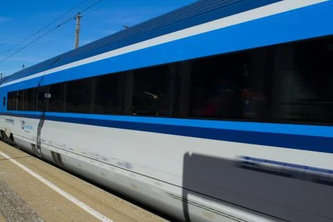 Blue train at the station Stock Photos
