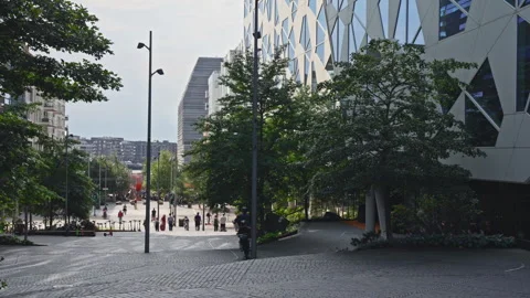 Blue tram passing near Barcode modern buildings. Stock Footage 342751403