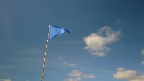 Blue triangle flag against blue sky in France Stock-Footage 135404810