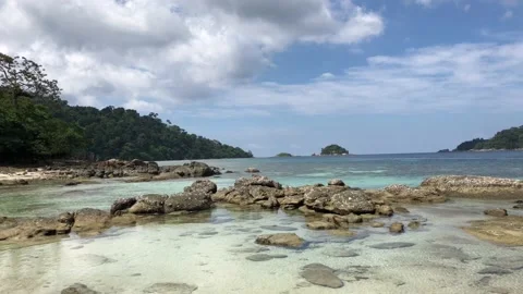 Blue Tropical Sea with Waves Gently Hitting Beach Rocks - Koh Lipe. Stock Footage 129128367