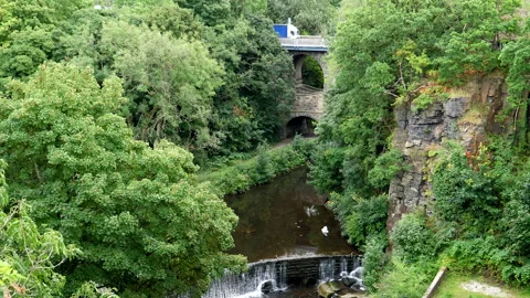 Blue truck on two level arch bridge Видео 228268277