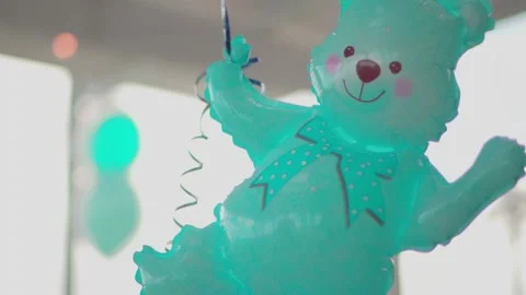 Blue, turquoise bear with helium Stock Footage 147683421