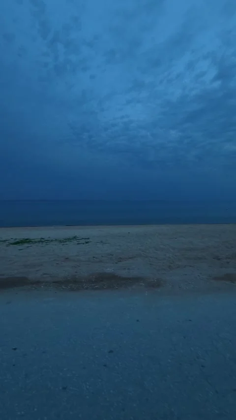 Blue twilight blankets calm beach. Nikiti, Greece. Vertical Stock Footage 338357748
