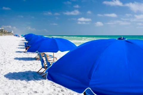 Blue Umbrellas at the Beach Stock Photos