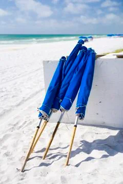 Blue Umbrellas at the Beach Stock Photos