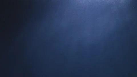 Blue underwater with light rays highlighting bubbles and particles, refract.. Stock Footage 293680626