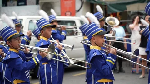 Blue Uniformed Brass Band Performing During Street Procession Stockbeeldmateriaal 345929392