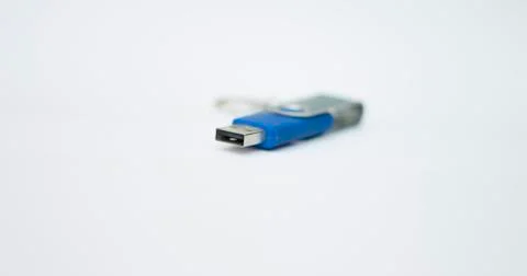 Blue usb flash drive for saving information on a white background close-up Stock Photos