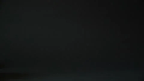 Blue used gloves on a black background Stock Footage 133420606