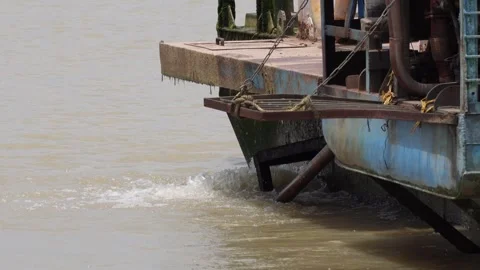 A blue vessel taking off and generating a turbulence in the water Stock Footage 314513264