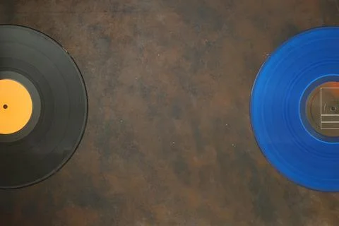 Blue Vinyl record on a rusty background. Retro style. Top view Stock Photos