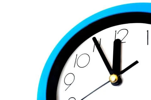 Blue wall clock isolated on white background. Stock Photos