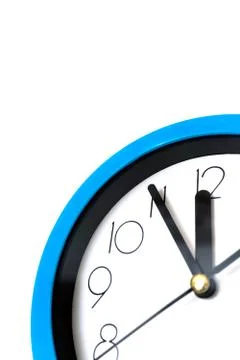 Blue wall clock isolated on white background. Stock Photos