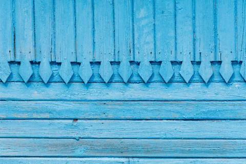 The blue wall has a pattern of triangles 写真素材