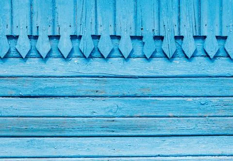 The blue wall has a pattern of triangles 写真素材