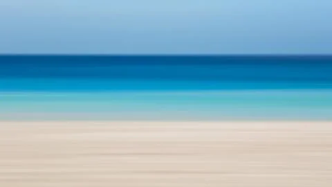 A blue wall with a pattern of dots and lines. The wall is made of concrete Stock Photos