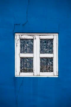 Blue wall with retro window Stock Photos