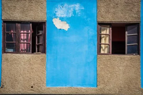 Blue wall with two brown windows in Cape Verde, Africa Stock Photos
