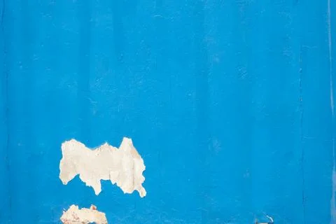 A blue wall with a white patch on it Stock Photos