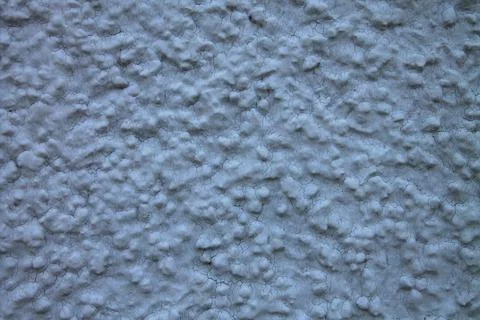 Blue wall.Close-up.Cracks, irregularities. Stock Photos