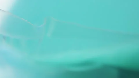 Blue washing machine tabs macro close up presentation slowly rotating stock.. 库存影片 344706703