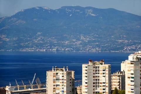 Blue water of Adriatic Sea and mountains in Rijeka city Croatia Stock Photos