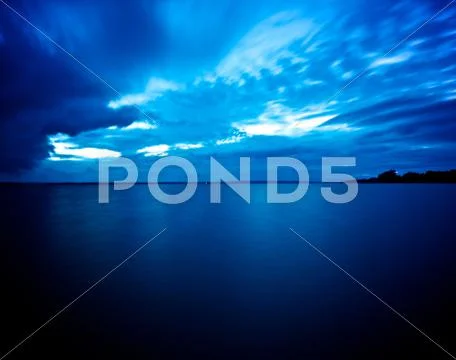 Blue water and sky Stock Photos