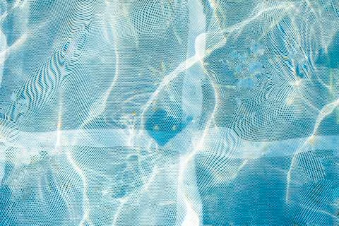 Blue water background or backdrop. Texture of the water surface. Stock Photos