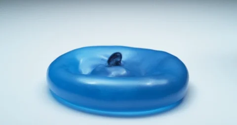Blue water balloon bouncing in super slow motion.  Shot on Phantom Flex 4K. Video stock 125344798