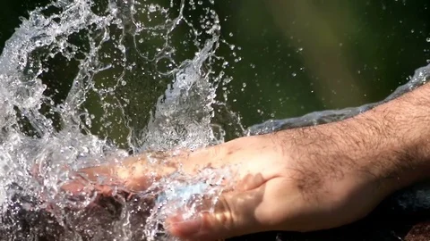 Blue Water Balloon Exploding When Smashed By Hand Super Slow Motion Video stock 71361834