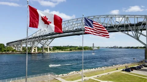Blue Water Bridge Flags slow creep in Stock Footage 312179712