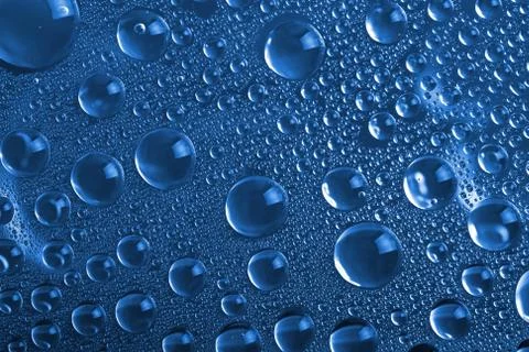 Blue water drops background Stock Photos