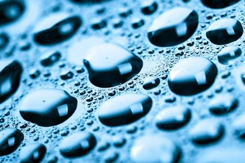 Blue water drops background Stock Photos