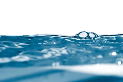 Blue water in motion with bubbles Stock Photos