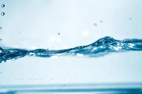 Blue water in motion with bubbles Stock Photos