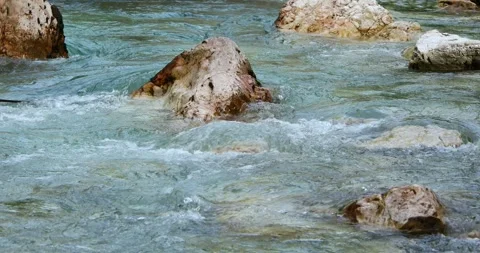 Blue water of a mountain river flows over the stones Stock Footage 248060602