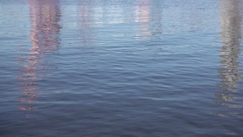 Blue water with  painterly reflections of city, calm motion background Видео 333328167