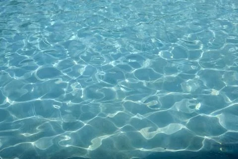 Blue water in the pool background Stock Photos